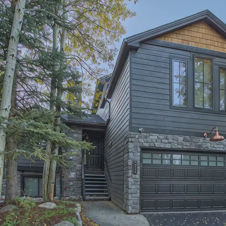 Dreamy home on river, mountain views, steps from town.