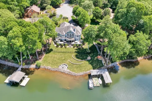 Go Jump In the Lake! Just Listed Custom Lakefront Home with Dock & Amenities! - 4-Star