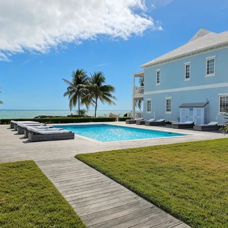 Luxury Beach side escape, steps from private beach, restaurant, marina, and café