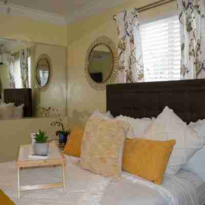 Entire Condominium Home away from Home with Pool, Near Beach Rooms
