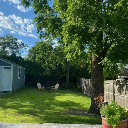 Charming Riverhead home with large outdoor patio & backyard  firepit