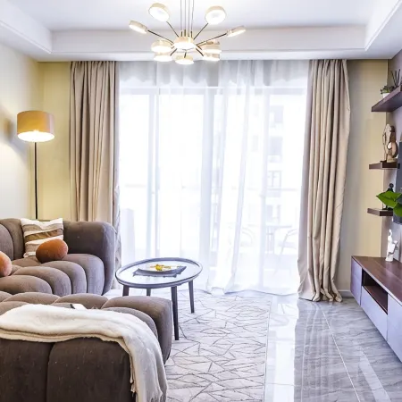 Chic Loft steps from Yaya Center | Pool + gym