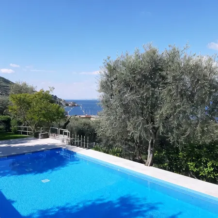Apartment Agnese with lake view, swimming pool, garage and private garden.