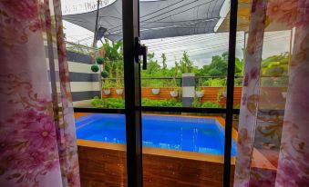 Serene 2Br Escape: Poolside Bliss in Iloilo City