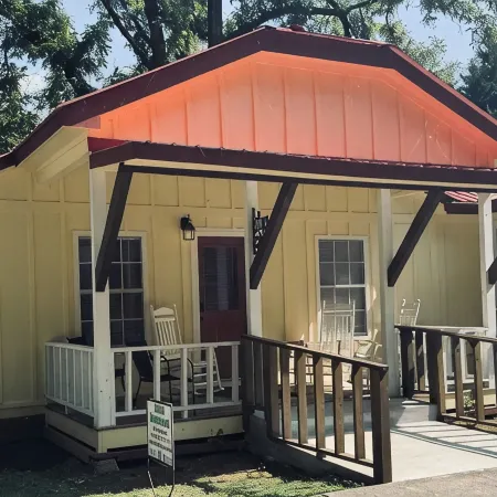Downtown by Chattahoochee River, sit on front porch as horse and buggy stroll by