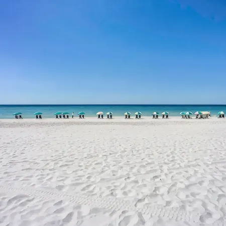 Beachfront resort property with spa, restaurants, pools, courts, and gyms.
