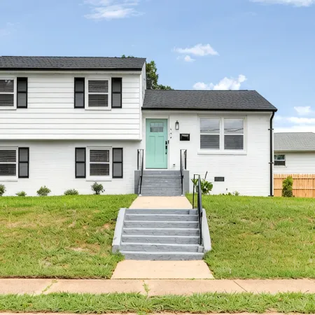 Stylish 4 bedroom house with outdoor dining and fenced backyard.