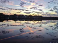 BEAUTIFUL WATERFRONT .  GNAT SCREENED BOATHOUSE AND AJOINING COVERED BOAT SLIPS