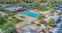 IDEAL LOCATION Siding a Park and Near Community Pools & Golf Course!