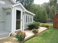 Riverfront Cottage w/ Boat Docking and easy access to Burt Lake