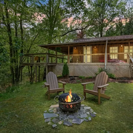 Cozy Creekside Cabin w/ Wraparound Covered Deck and Barrel Sauna