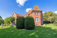 Kornboden vacation apartment in the Pilsumer Hof with a fantastic garden - Wifi