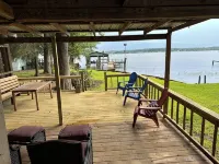 Peaceful lake front home with wrap around porch and relaxing views!