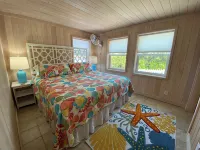 Pink Bikini Island Cottage with a dock on Black Sound - 4-Star