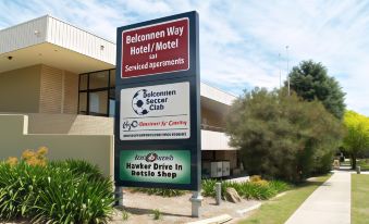 a large sign for a hotel / motel and a recreation center , advertising the rooms available at Belconnen Way Hotel & Serviced Apartments