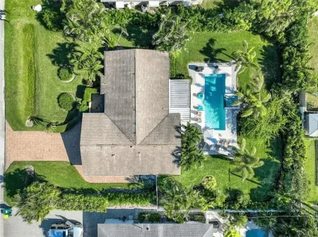 Three-bedroom home with backyard heated pool oasis. 5 minutes to the beach