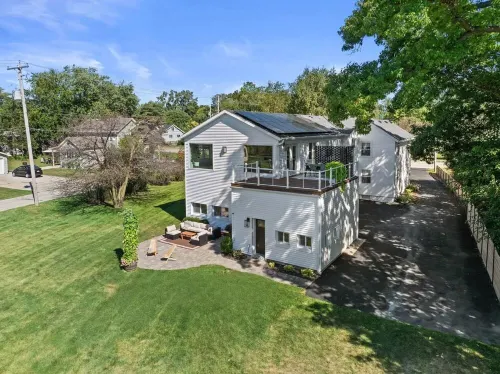 Custom Home with Lake Views + Cozy Fireplace