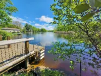 Spacious 4-bedroom waterfront house in Sylvan Beach with private yard and dock.