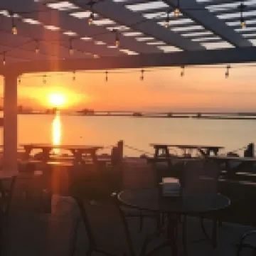 Balcony with Partial Lake View and Pool Access - Charming Condo Escape