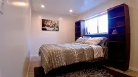 3-bed/2 bath basement apt. in charming Midvale with AC, wifi, laundry & hot tub.
