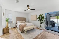 Charming 2-bedroom house with pool and fenced in backyard. Sleeps 8
