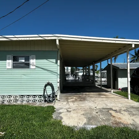 Canal-Front Coastal Escape with Private Dock & King Suite