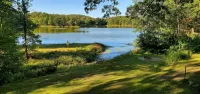 Charming 2-bedroom cottage with WiFi, AC on quiet lake on trails with kayaks. - 2-Star
