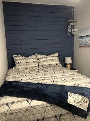 Charming shipping container home with lake view and boat ramp.