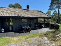 Cozy vacation home in southern Norway (Tromøy, Arendal) with a boat and a pier.