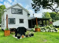 Experience the Charm of a Rustic Lakefront Cottage, Perfect for Year-Round Fun!