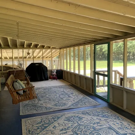 LOTS of parking for vehicles and boats. Large porch with swing and table, chairs
