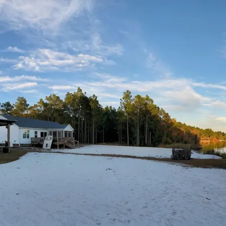 Lake front living with private sandy beach!