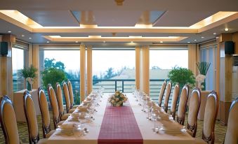 a long dining table set up for a formal event , with multiple chairs arranged around it at Palace Hotel