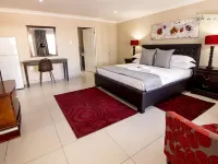 Airport Gardens Boutique Hotel Hotels near K90 Centre