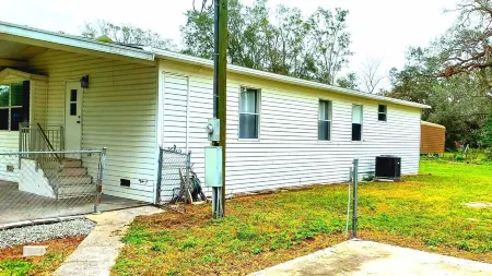 House with 3-bedroom 2 Bath on one acre of land in wonderful Wesley Chapel