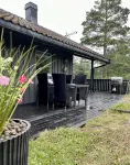 Cozy vacation home in southern Norway (Tromøy, Arendal) with a boat and a pier.