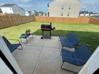 5 bedroom spacious home, with charcoal grill and seating. Peaceful neighborhood.
