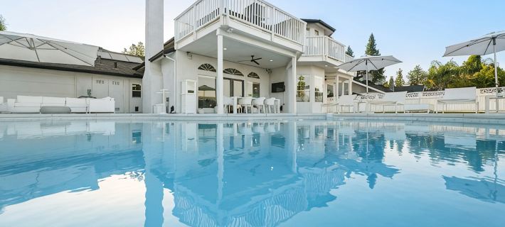 Inspired by the iconic white buildings and turquoise waters of Greece. Hotels in Visalia