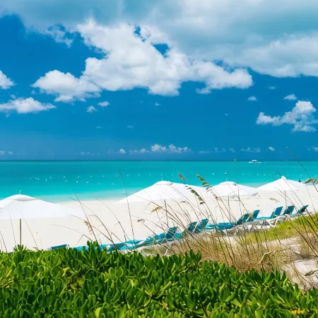 Walk Out of this Elegant 2 Bedroom Condominium On To Stunning Grace Bay Beach!