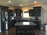Upstairs of a newer ranch style home.  Owner resides in locked off basement. - Condos