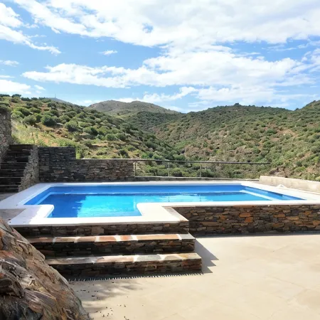 A charming family home with private pool in Cadaques with sea views.
