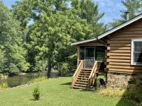 Tranquil Riverfront Retreat - Hytter