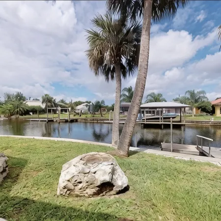 Spacious 3 BR 2 Bath  House On Deep Canal With Screened Heated Pool