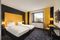 Vienna House Easy by Wyndham Katowice Hotels near Cemetery chapel of Saints Apostles Peter and Paul Parish on Sienkiewicza Street in Katowice