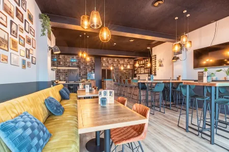 Hotel de Werf Отели в г. Huisduinen