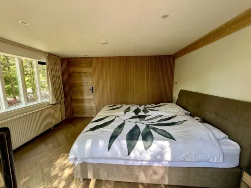 Child-friendly holiday home near a pool and playground in the forests of Veluwe - 2つ星
