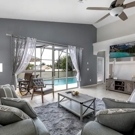 Lovely home near Disney with a Heated pool and game room in a resort community.