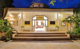 "a large , white building with steps leading up to the entrance , and a sign above the door that reads "" casa de campina .""." at Lampam Resort