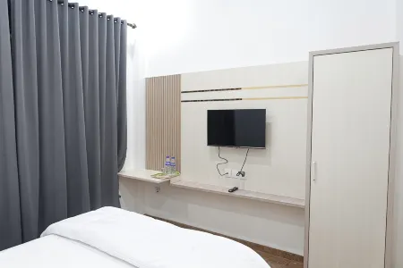 Karya Guest House Syariah Отели в г. Mendalo Darat