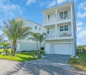 Coastal Luxe Villa! Tranquil 3-Story Retreat with Bay Views near Anna Maria Isl
